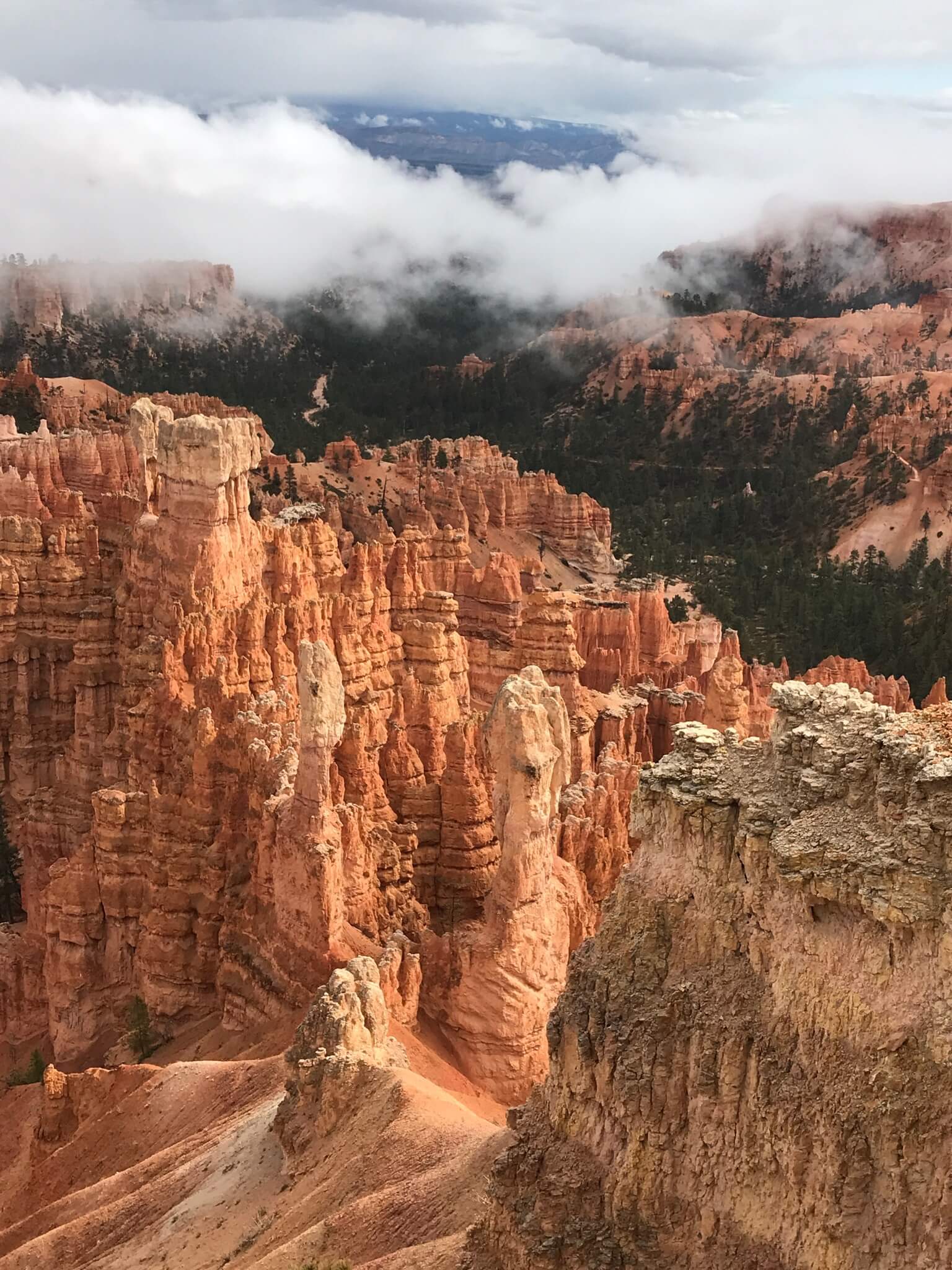 An image of bryce canyon with big clouds